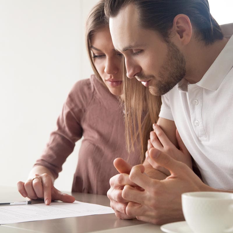 Couple discussing a cohabitation or prenuptial agreement